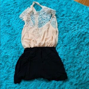 Midnight doll romper with elegant tie neck line